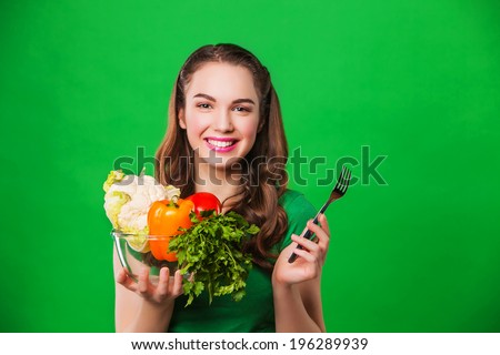 young woman with a plate full of healthy food. diet