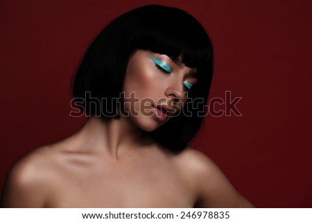 portrait of fashion woman model with turquoise arrow