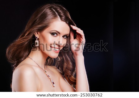 beautiful fashion model with perfect makeup wearing jewelry