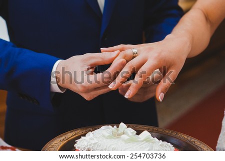 Groom wearing the Diamond ring to bride hand in Wedding ceremony