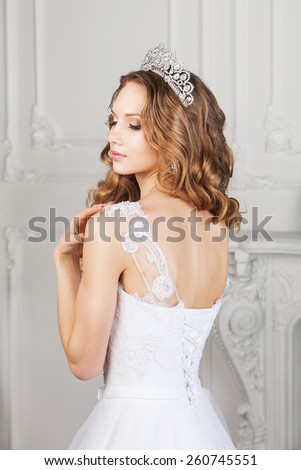 Back view of bride with wedding hairstyle and makeup. Bride fashion. Jewelry and Beauty.