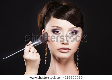 Model with evening makeup. Cosmetic. Perfect evening make-up. Applying make-up