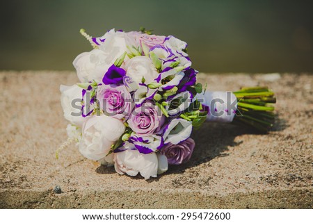 Brides bouquet with colorful flowers on wedding day