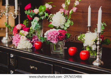 Beautifully decorated wedding table. Gorgeous flowers on table in wedding day