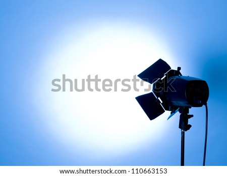 empty studio background and flash light on light blue