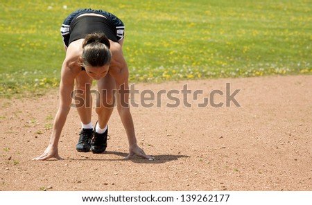 female runner during her start outdoors