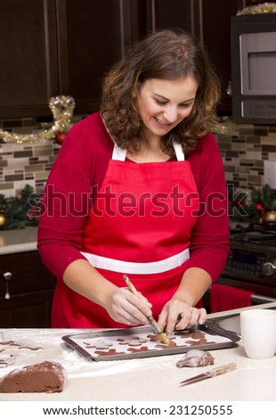 woman making ginger bread cookies in the kitchen