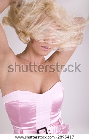healthy beautiful blond long hair in motion created by wind, fashion look