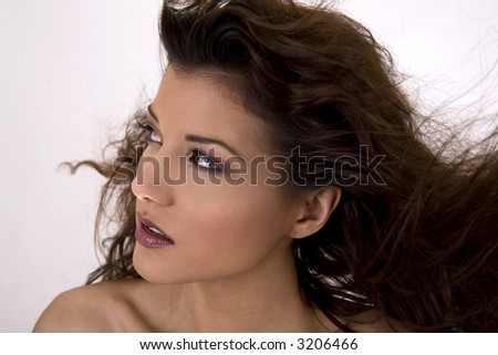 healthy beautiful long hair in motion created by wind, fashion look