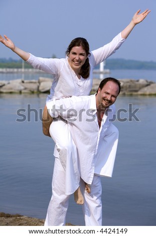 couple having fun on the beach during summer days