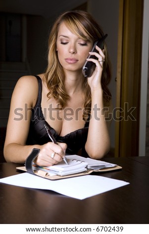 stunning woman on the phone in the office