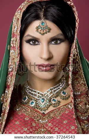 stock photo beautiful indian woman wearing bridal outfit on red