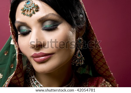 stock photo beautiful indian woman wearing bridal outfit on white