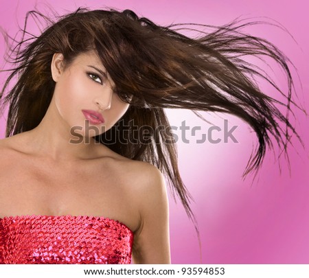 beautiful brunette having fun on pink background