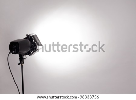 empty studio background and flash light on light grey