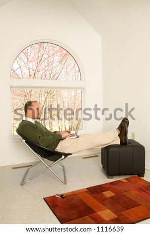 Wide Shot Young Man Working in Home Office