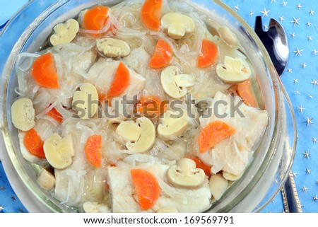Herring fish in oil with carrot, onion and mushrooms