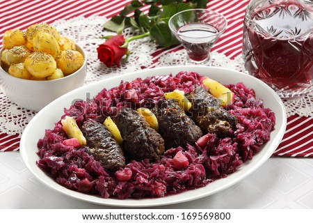 Beef rolls with red cabbage and roast potatoes