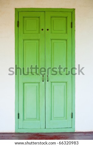 green door and white wall