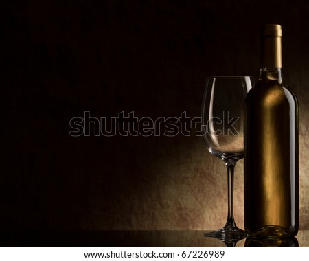 bottle with white wine and glass
