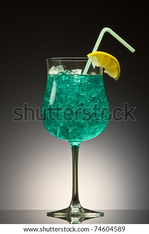 Blue Hawaiian cocktail on a gray gradient