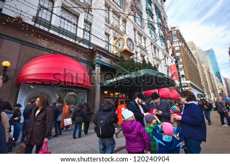 NEW YORK CITY - DEC 2:  Christmas shopper at Macy\'s department store in Herald Square, NYC on Dec 2, 2012.  This building was added to the National Register of Historic Places as a landmark in 1978.