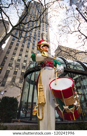 NEW YORK CITY - DEC 2: Toy soldier statue at Rockefeller Center in NYC on Dec 2, 2012. Declared a National Historic Landmark Rockefeller Ctr. is home to the iconic NYC Christmas Tree and skating rink.