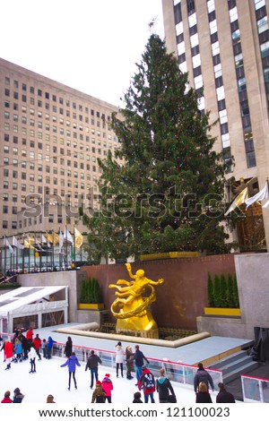 NEW YORK CITY - DEC 2: Visitors at Rockefeller Center in NYC on Dec 2, 2012. Declared a National Historic Landmark Rockefeller Ctr. is home to the iconic NYC Christmas Tree and ice skating rink.