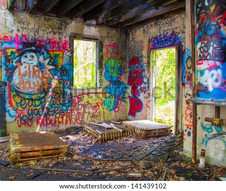 GLEN COVE, NY - MAY 10: Graffiti covered abandoned building on grounds of Pratt Mansion, Glen Cove NY on May 10, 2013. Former home of Harold Pratt the estate was once a Long Island Gold Coast Mansion