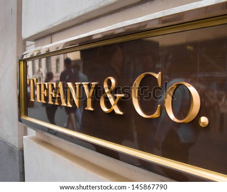 NEW YORK CITY - MAY 17: Sign at Tiffany & Co. Building on Wall Street in the Financial District in NYC on May 17 2013. Tiffany\'s is a luxury American multinational jewelry and silverware corporation.