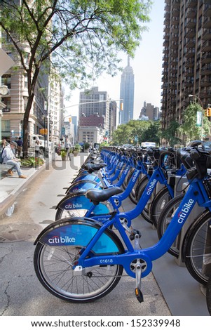 NEW YORK CITY - AUG 1: Row of Citi Bike bicycles in midtown Manhattan on Aug 1, 2013. This bicycle sharing system serving New York City is the largest bike sharing program in the United States.