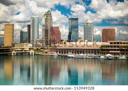 Tampa Florida Skyline With Sun, Clouds And Reflections