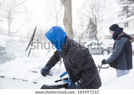 West Hempstead, Ny - Jan 3: Men Clear Snow In Driveway On Long Island, Ny On Jan 3 2014 After Snow Storm. This Powerful Nor\'Easter Named Hercules Caused Blizzard Conditions On Long Island.