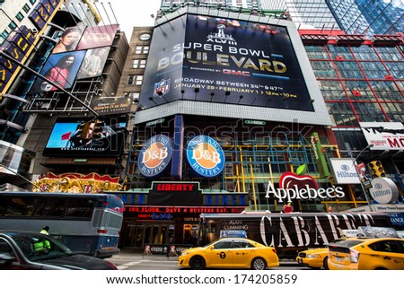 NEW YORK CITY - JAN. 31, 2014: Times Square in Manhattan prior to Super Bowl XLVIII. To celebrate the upcoming Super Bowl the city hosts a football themed experienced called Super Bowl Boulevard