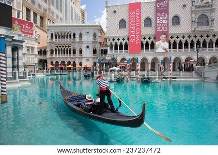 LAS VEGAS, NEVADA - MAY 7, 2014:  Venetian Palazzo Resort Casino with Grand Canal and gondola in view. This luxury hotel opened in 1999.