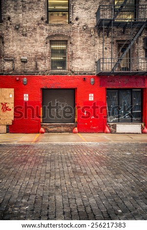 Urban building with loading bay and cobblestone street