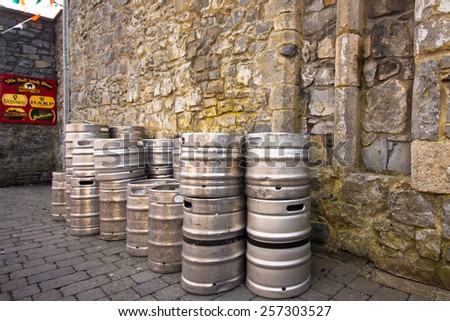 KILKENNY, IRELAND - MARCH 28, 2013:  View of stack of Guinness beer kegs outside a pub in Kilkenny Ireland.