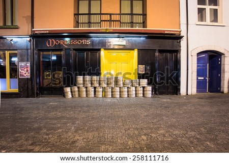 KILKENNY, IRELAND - MARCH 27, 2013:  Beer kegs outside pub on the street in Kilkenny Ireland
