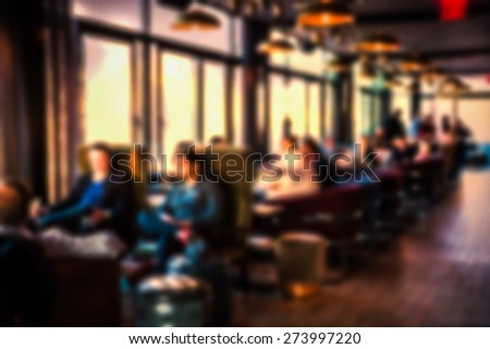 Restaurant lounge blur with people relaxing
