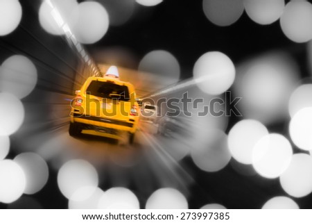 NYC yellow taxi with lights in tunnel