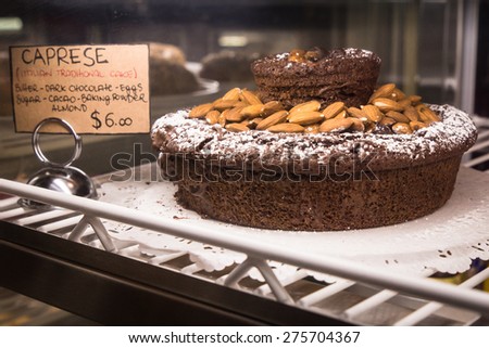 NEW YORK CITY - MARCH 13, 2015:  New York City dessert cuisine of nut and chocolate Italian style cake  in speciality market display case.