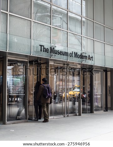 NEW YORK CITY - MARCH 14, 2014: Entrance to The Museum of Modern Art with people entering in Manhattan. This landmark museum opened its doors to the public in 1929.