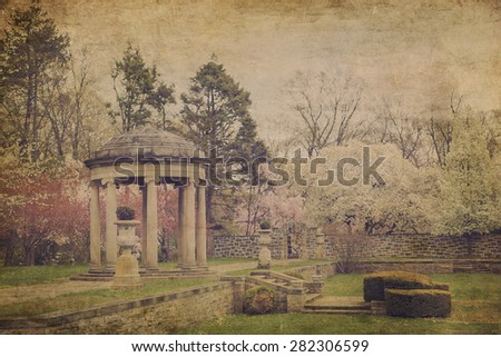 Vintage postcard textured effect of lovely garden path covered and marble gazebo