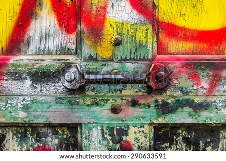 Grungy graffiti covered garage door with handle