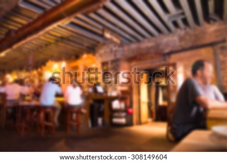 Defocused blur of scene inside restaurant pub and bar