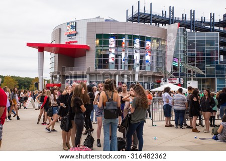 FOXBORO, MASSACHUSETTS - SEPTEMBER 12, 2015:  Fans await entry into Gillette Stadium, home of the New England Patriots,  for the One Direction concert.