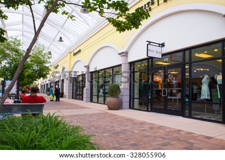 DEER PARK, NY - JULY 22, 2015: View of Tanger Factory Outlet outdoor shopping mall on Long Island, NY