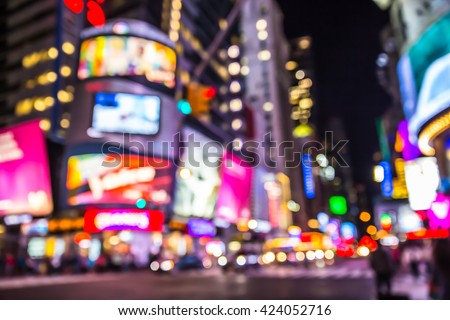 New York City defocused blur of Times Square lit up at night