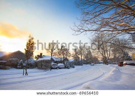 A typical American street as the sunrises after a winter storm