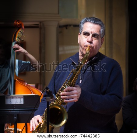 Older man playing sax